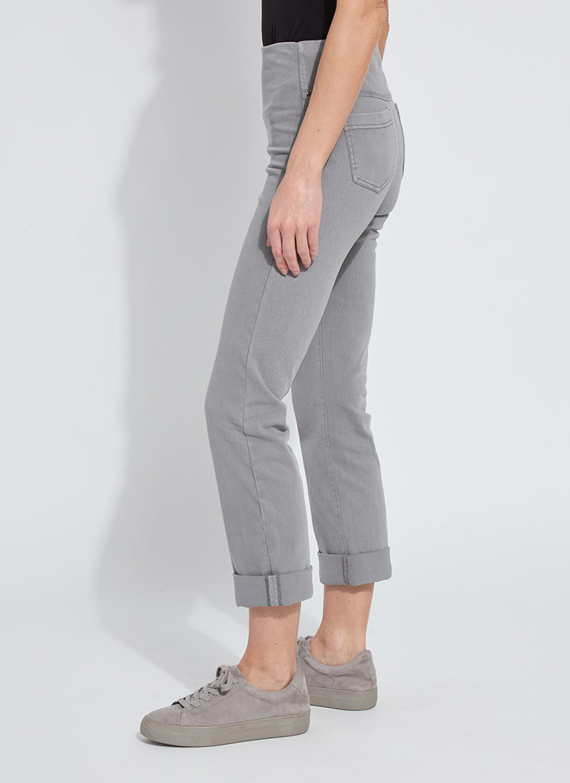 Side profile of grey rolled cuff pants styled with casual shoes