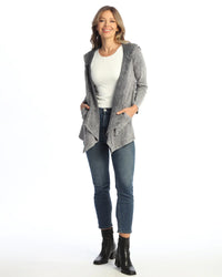 Woman wearing a slate grey waterfall hoodie cardigan with jeans and boots