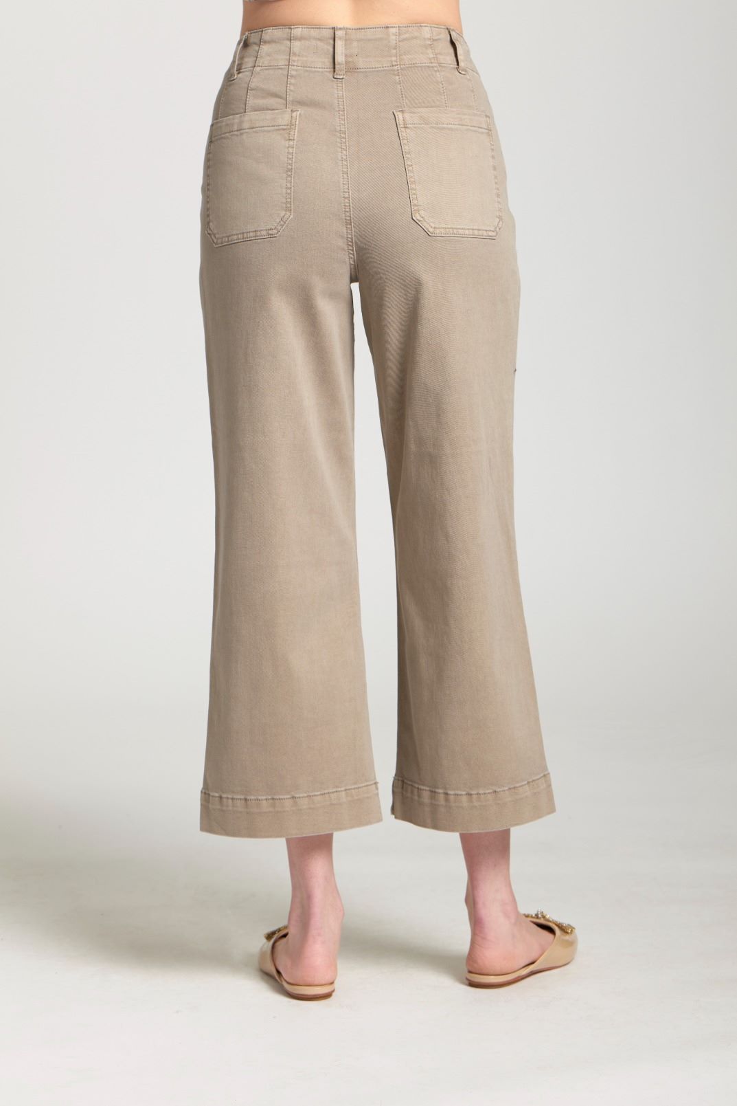 Back view of taupe wide-leg crop pants showing rear pockets and cropped hem