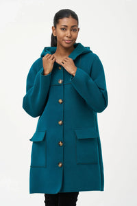 Model wearing teal wool hooded coat with button front