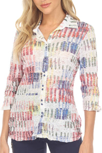 Model front view wearing Color Burst Crinkle Button-Up Blouse with blue pants