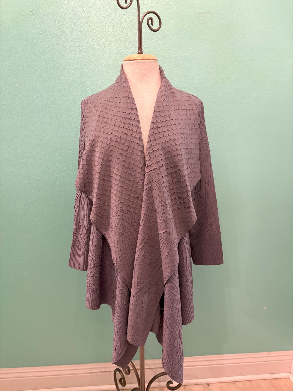 Front view of mauve waterfall cardigan with scalloped textured pattern