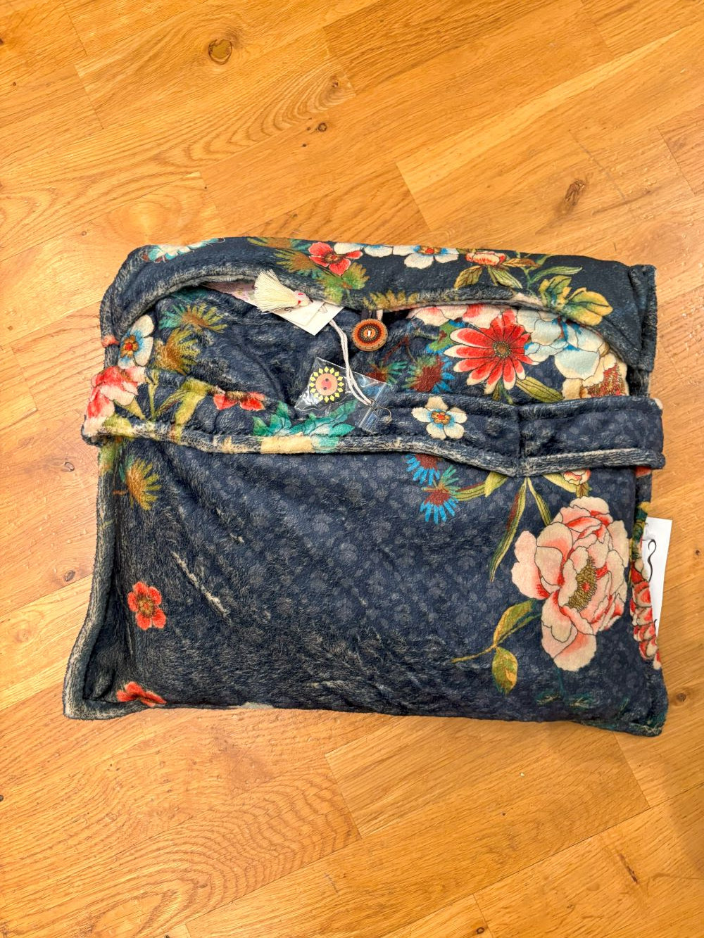 Mandala-patterned travel blanket with geometric and boho accents laid flat