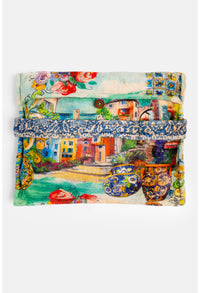 Unfolded travel blanket with scenic Mediterranean and floral artwork