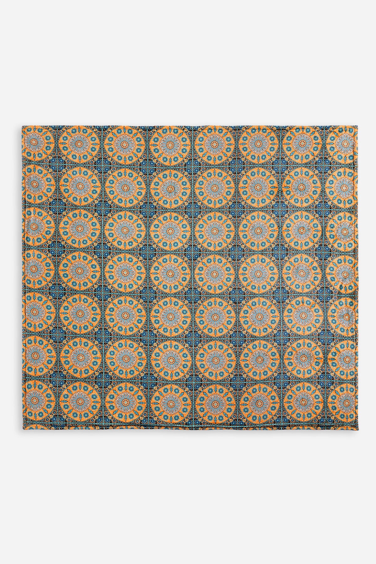 Folded velvet blanket with intricate medallion design in blue and gold