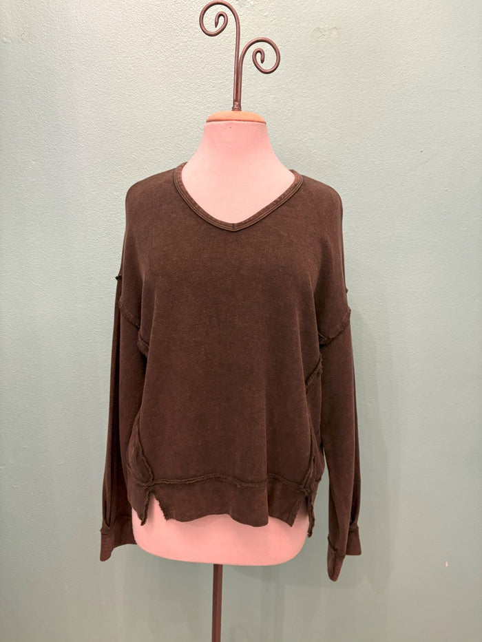 Front view of a vintage brown raw hem sweatshirt with distressed details