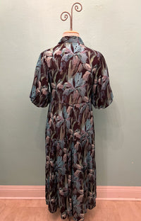 Back view of the vintage dress showing the flowing floral design