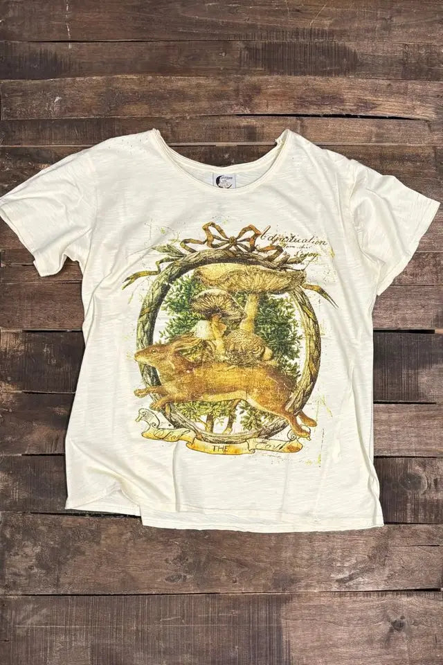 Cream t-shirt with vintage woodland graphic of mushrooms and deer on wooden background