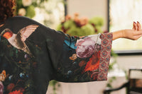 Kimono sleeve detail with floral motifs and patterned trim